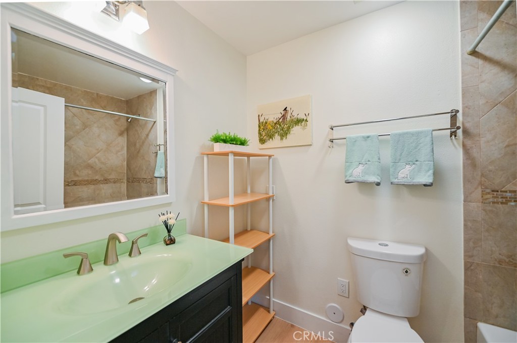 15 Camphor South Irvine, CA 92612 - Photo 24 of 28 a bathroom with a sink mirror vanity and toilet