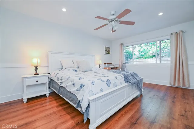 a bed room with a bed and a window