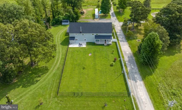 a view of a lake with a yard