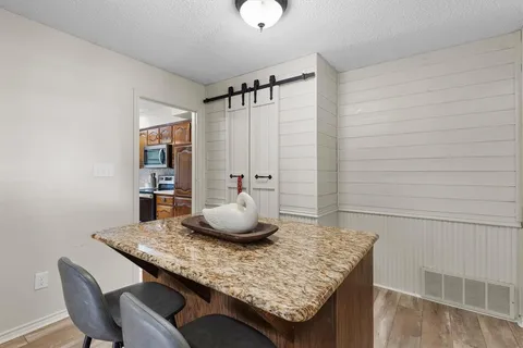a room with a table and chairs