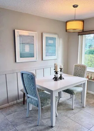 a view of a dining room with furniture