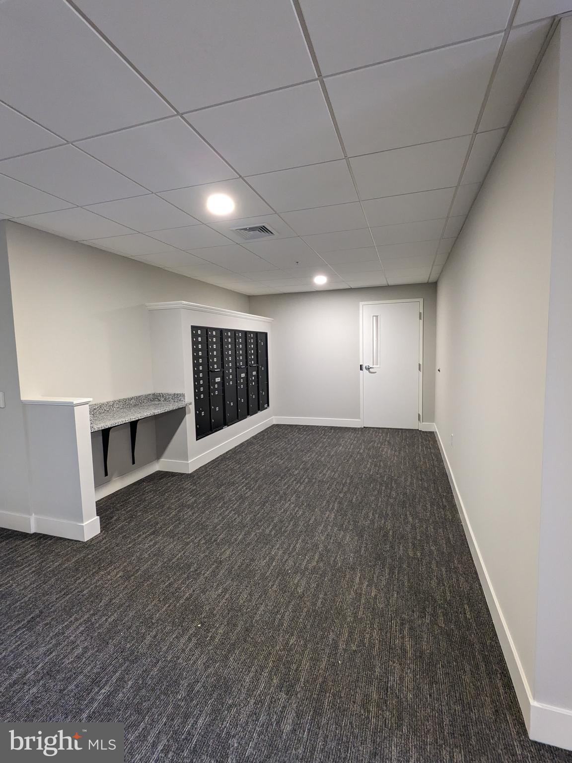315 Locust Street Columbia, PA 17512 - Photo 13 of 25 an empty room with wooden floor and natural light