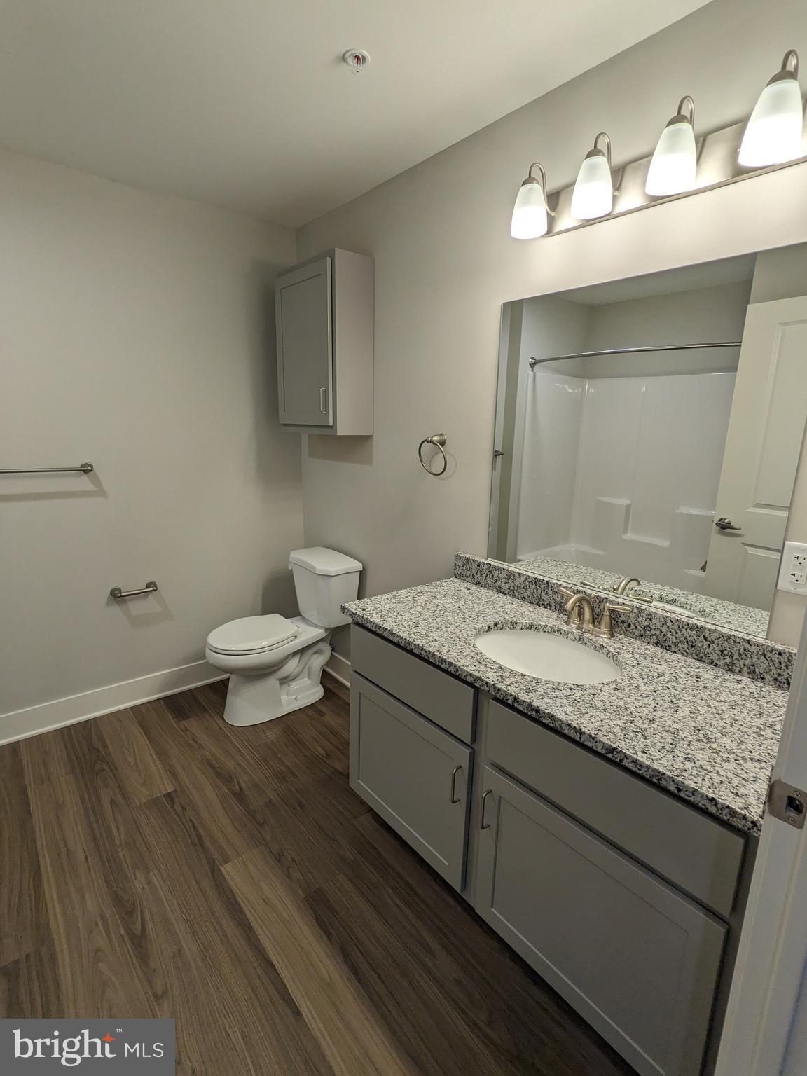 315 Locust Street Columbia, PA 17512 - Photo 15 of 25 a bathroom with a granite countertop sink and a mirror