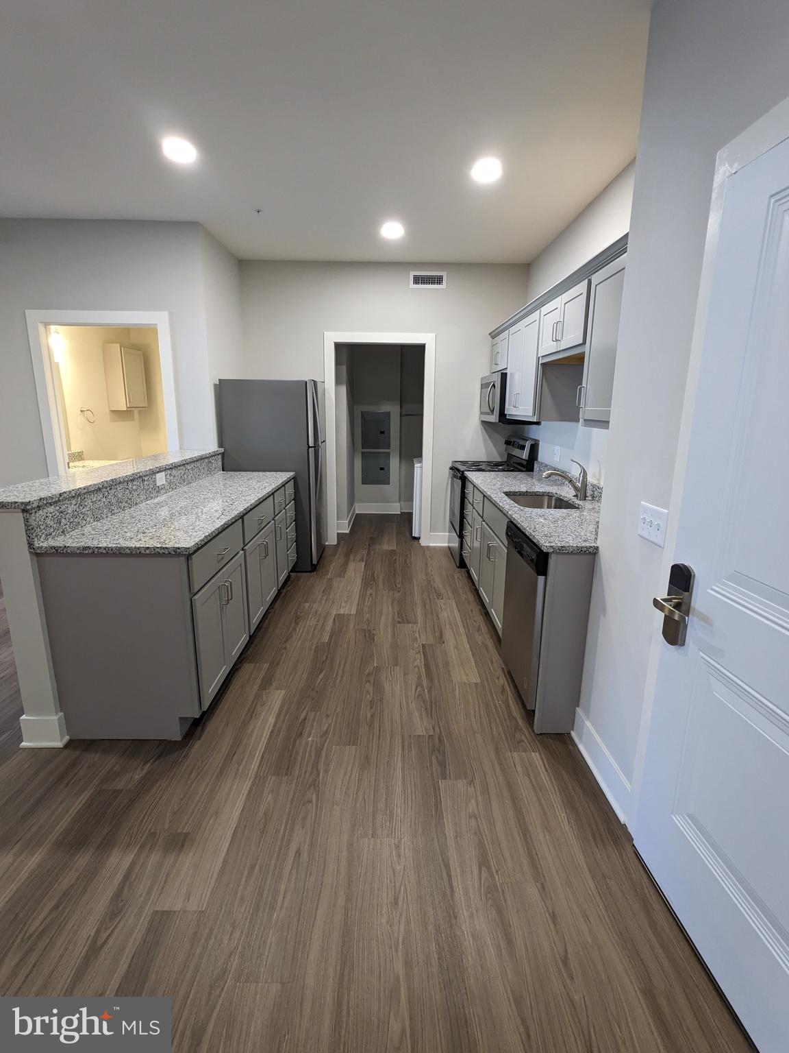 315 Locust Street Columbia, PA 17512 - Photo 24 of 25 a living room with stainless steel appliances granite countertop furniture wooden floor and a window