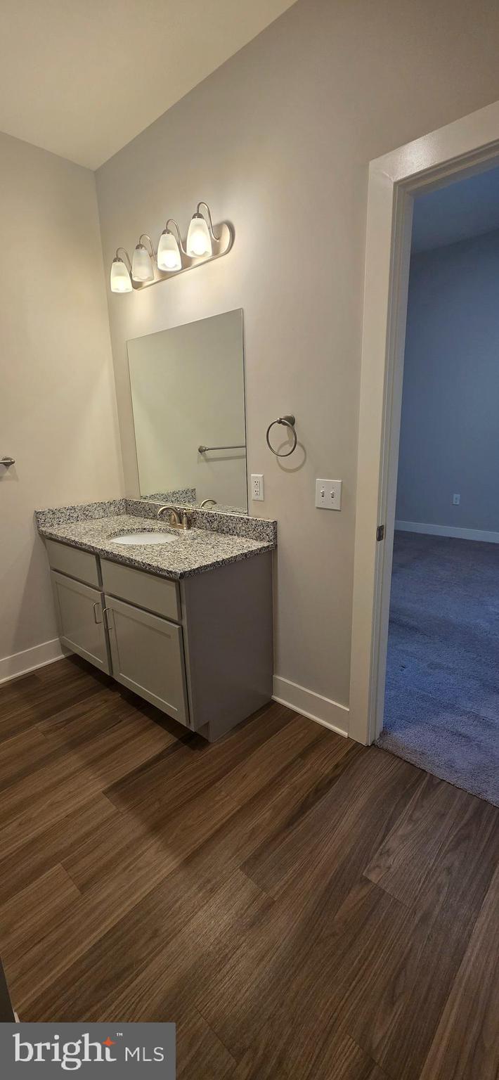 315 Locust Street Columbia, PA 17512 - Photo 6 of 25 a living room with a sink mirror and vanity