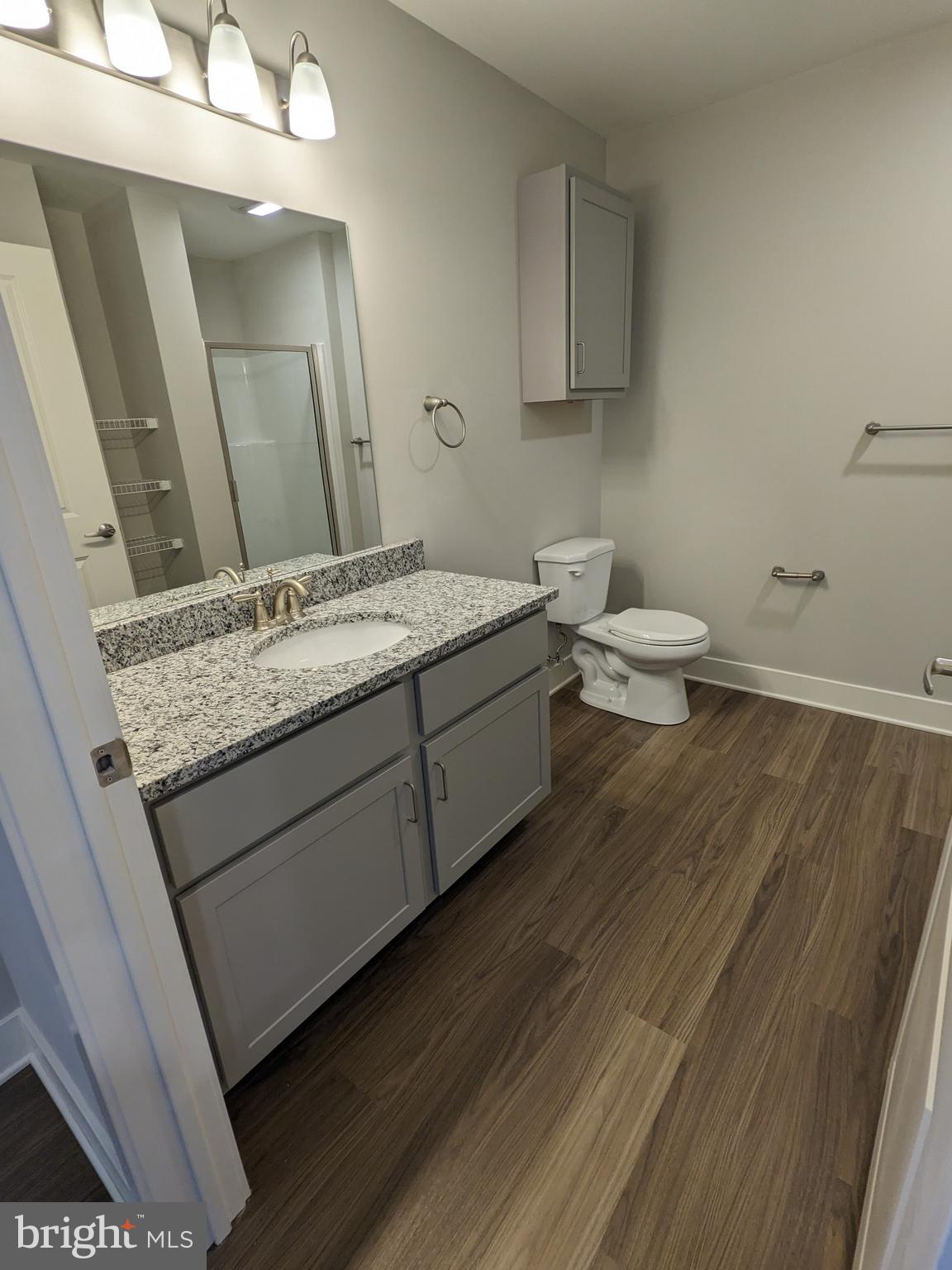 315 Locust Street Columbia, PA 17512 - Photo 8 of 25 a bathroom with a granite countertop sink and a mirror