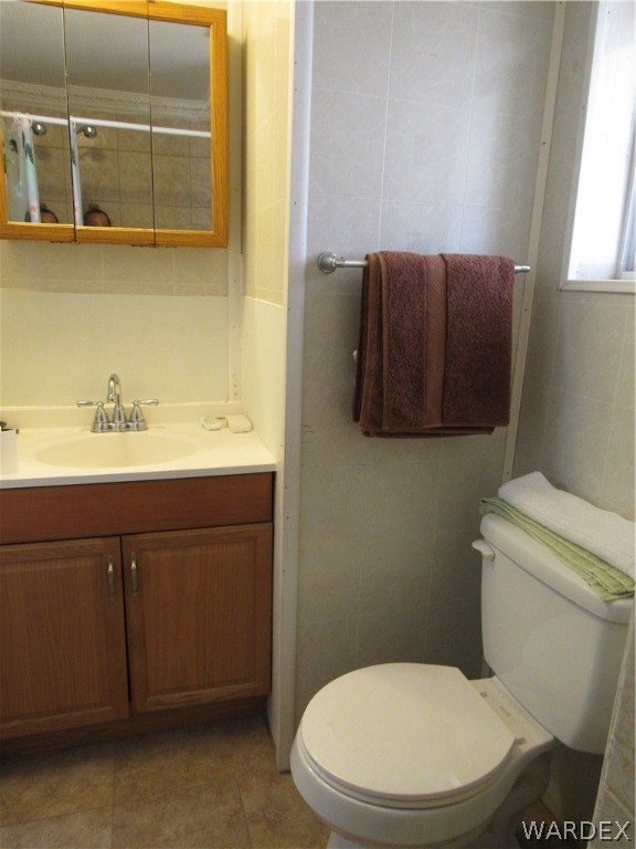 1846 Rio Grande Road Bullhead City, AZ 86442 - Photo 18 of 18 a bathroom with a toilet a sink and mirror