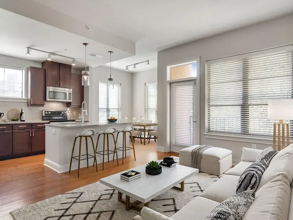 a living room with furniture and a table