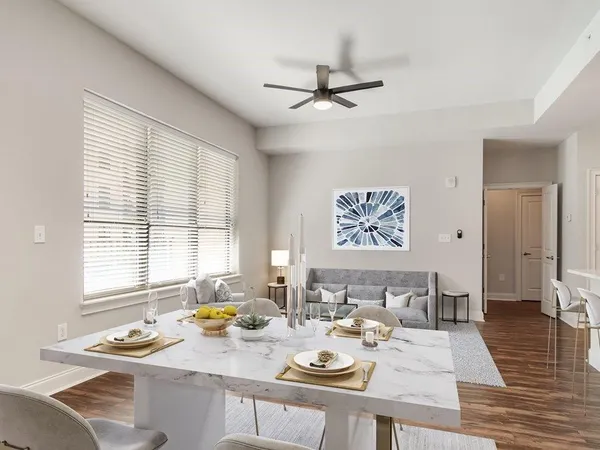 a view of a dining room with furniture window and wooden floor