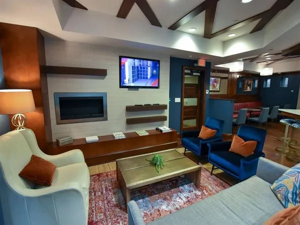 a outdoor living space with furniture and a fireplace