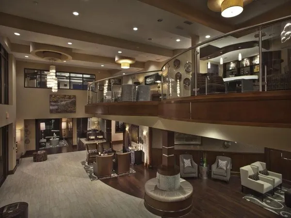 a room with lots of table and chairs