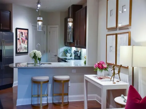 a living room with furniture and flowers