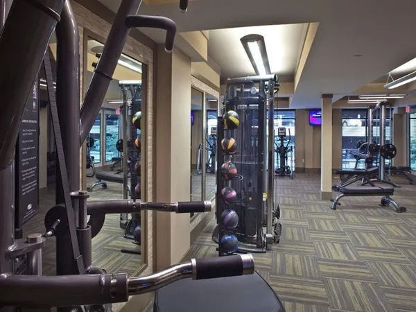 a living room with lots of furniture and chandelier