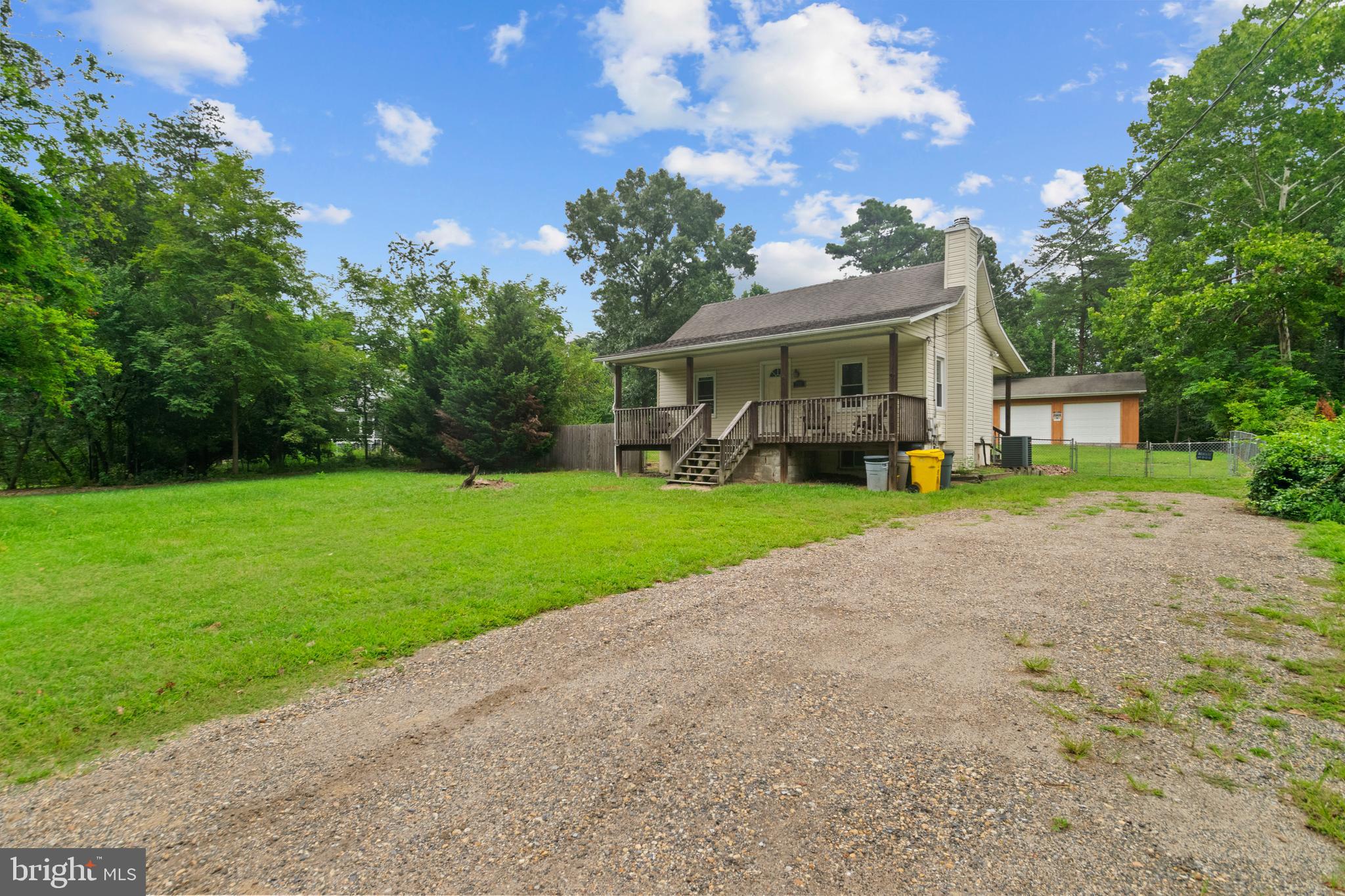 7721 Locust Wood Road Severn, MD 21144 - Photo 3 of 29 a view of house with a garden and yard