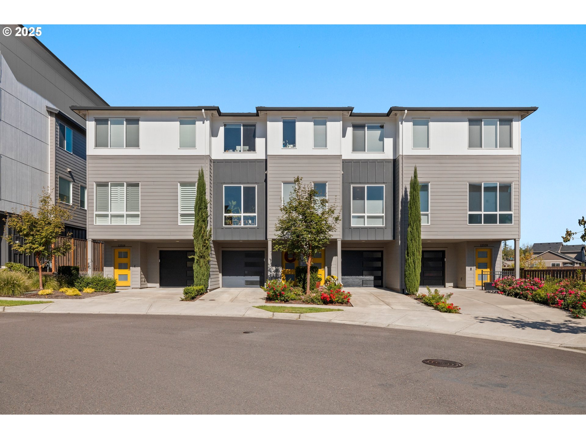 12524 Southwest 171st Terrace Beaverton, OR 97007 - Photo 2 of 40 a view of a building with a street