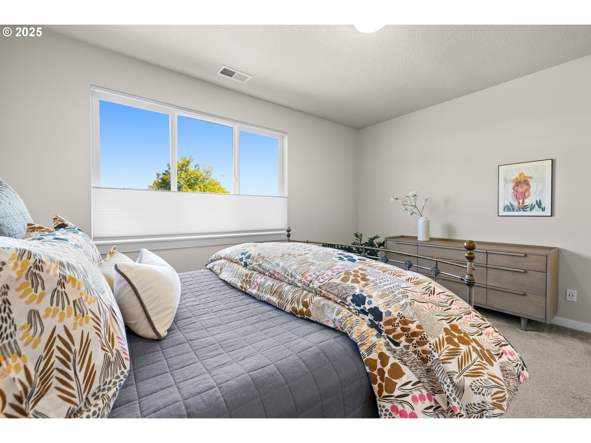 12524 Southwest 171st Terrace Beaverton, OR 97007 - Photo 21 of 40 a bedroom with a bed and a couch