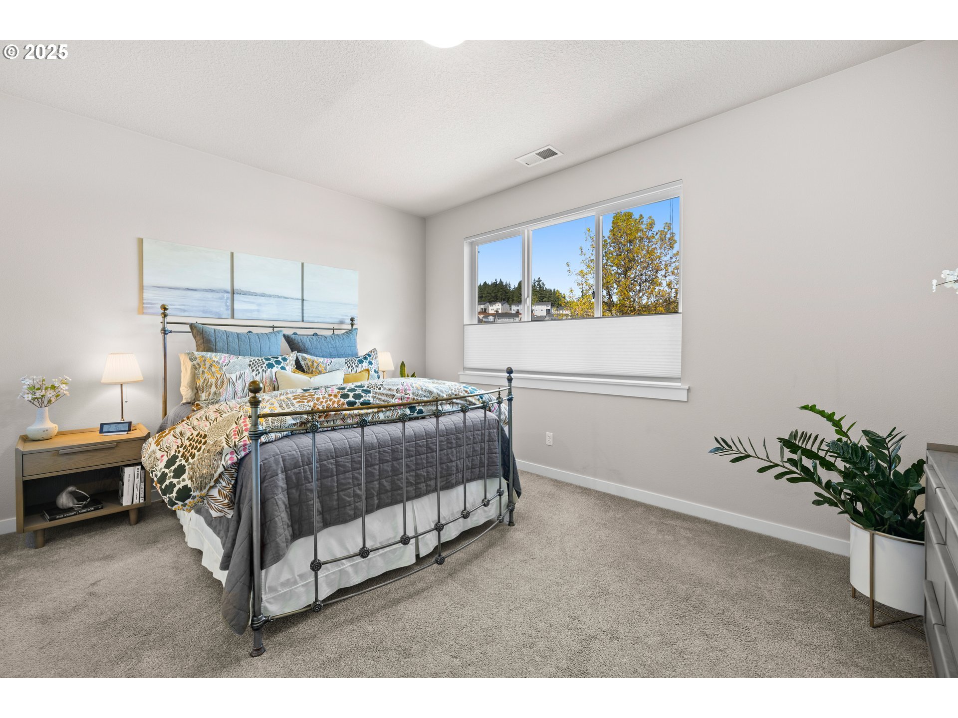 12524 Southwest 171st Terrace Beaverton, OR 97007 - Photo 22 of 40 a bedroom with a bed window and wall painting