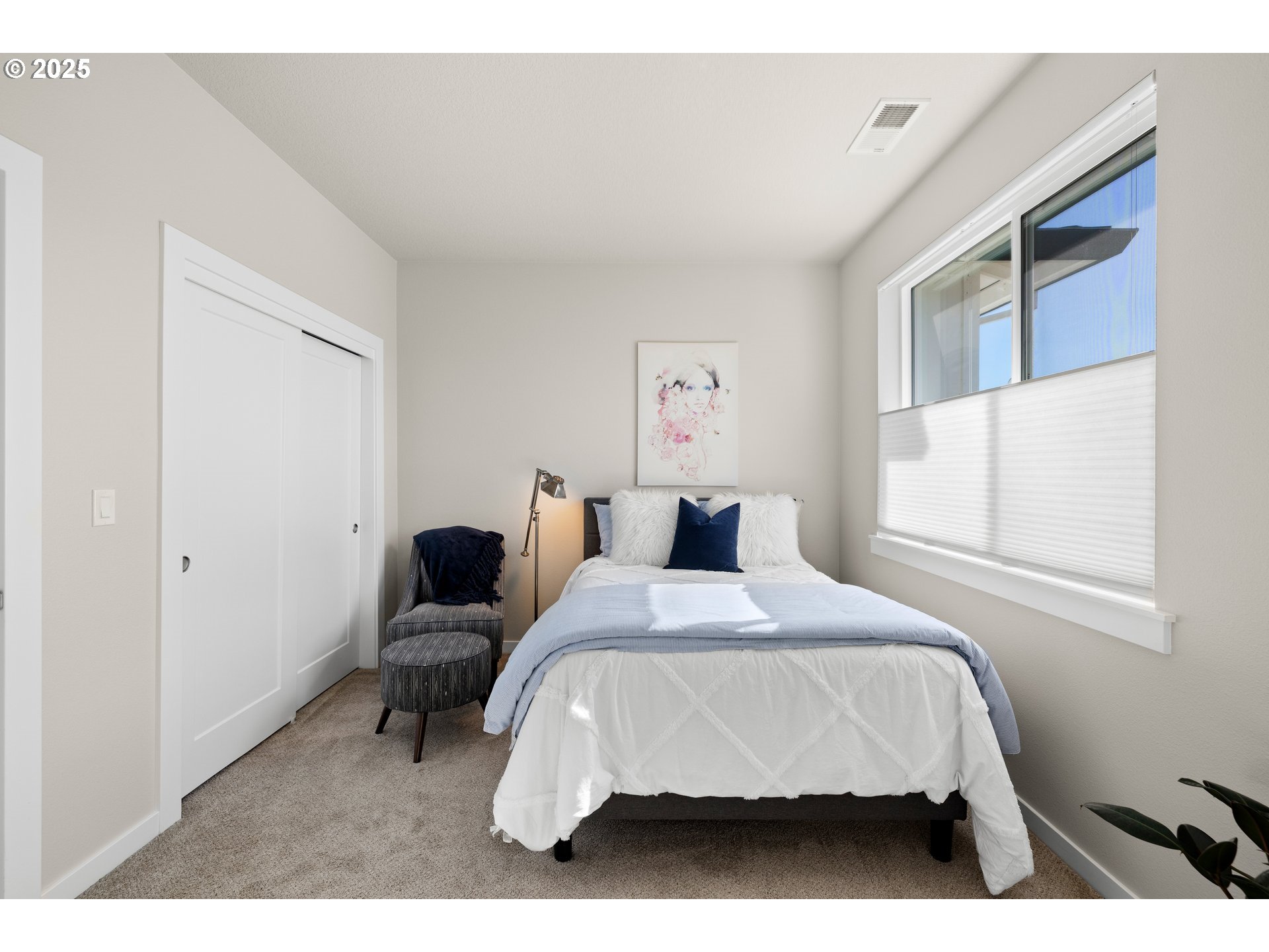 12524 Southwest 171st Terrace Beaverton, OR 97007 - Photo 27 of 40 a bedroom with a bed and window