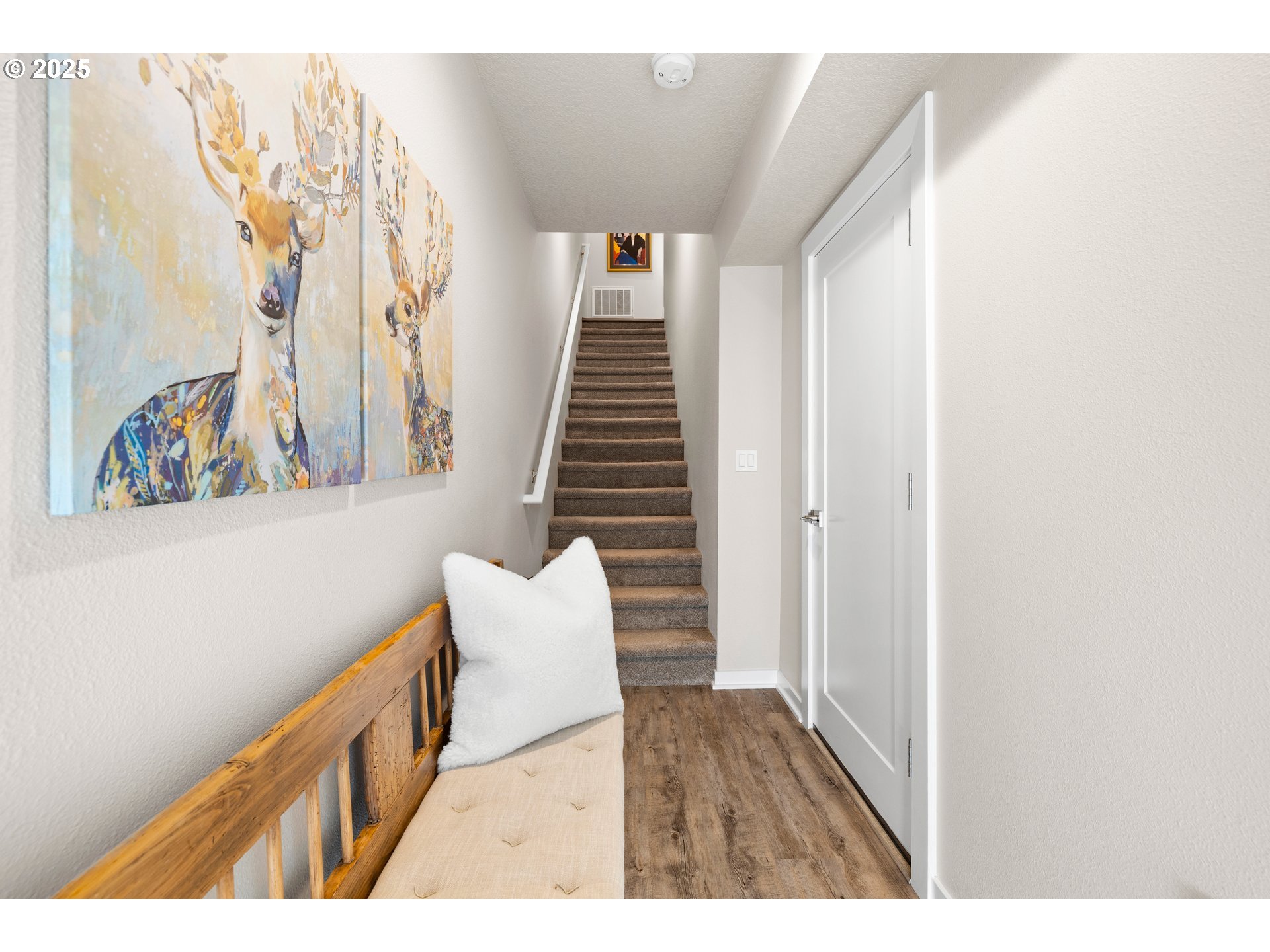 12524 Southwest 171st Terrace Beaverton, OR 97007 - Photo 6 of 40 a view of a hallway with wooden floor and stairs