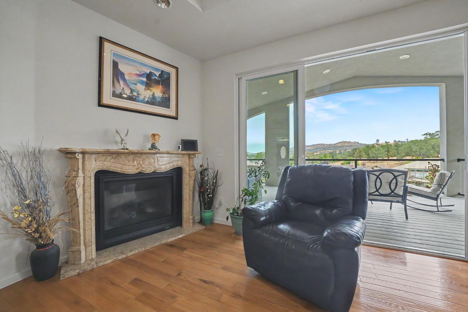 6066 Bluff View Road Copperopolis, CA 95228 - Photo 21 of 96 a living room with furniture and a fireplace