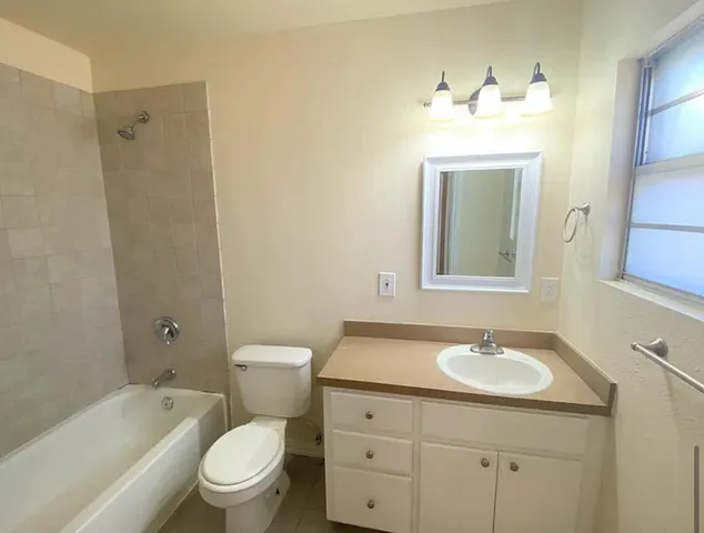 a bathroom with a toilet sink shower and bathtub