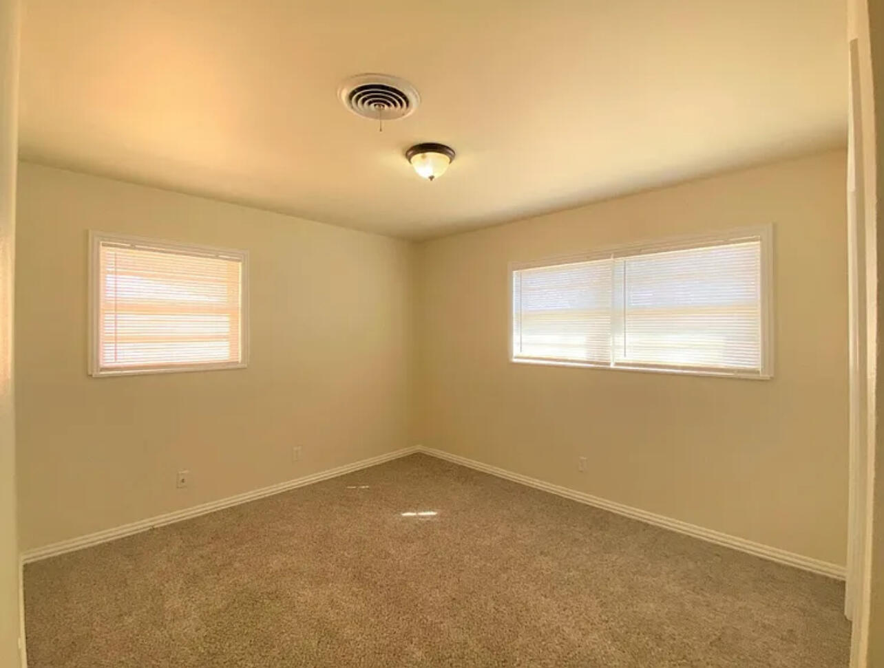 4908 43rd Street Lubbock, TX 79414 - Photo 16 of 18 an empty room with a window