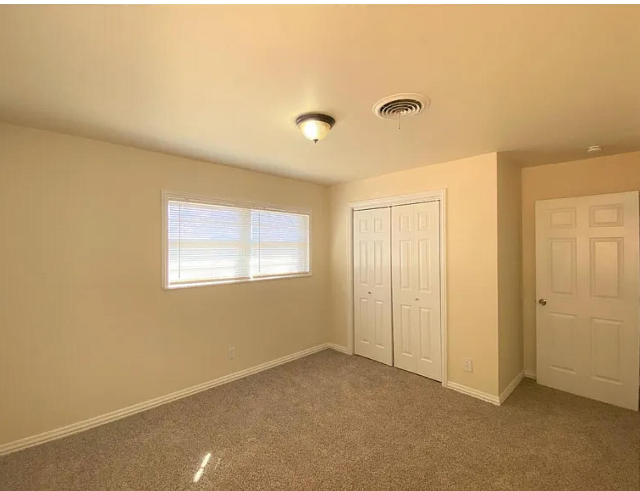 4908 43rd Street Lubbock, TX 79414 - Photo 17 of 18 a view of an empty room with a window