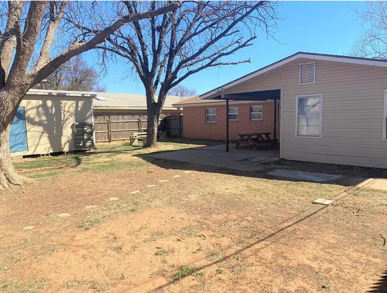 4908 43rd Street Lubbock, TX 79414 - Photo 18 of 18 a front view of a house with a yard
