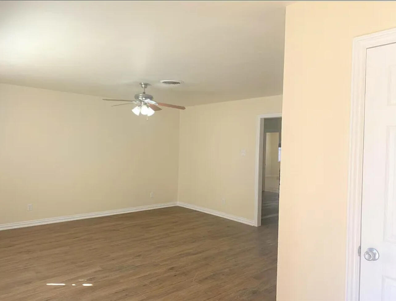 4908 43rd Street Lubbock, TX 79414 - Photo 2 of 18 a view of a room with wooden floor