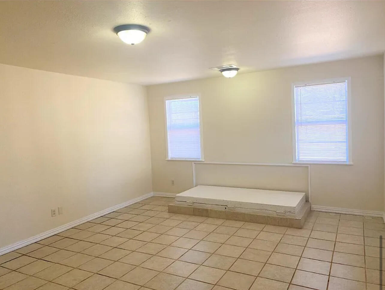 4908 43rd Street Lubbock, TX 79414 - Photo 9 of 18 a bathroom with a sink a vanity and a mirror