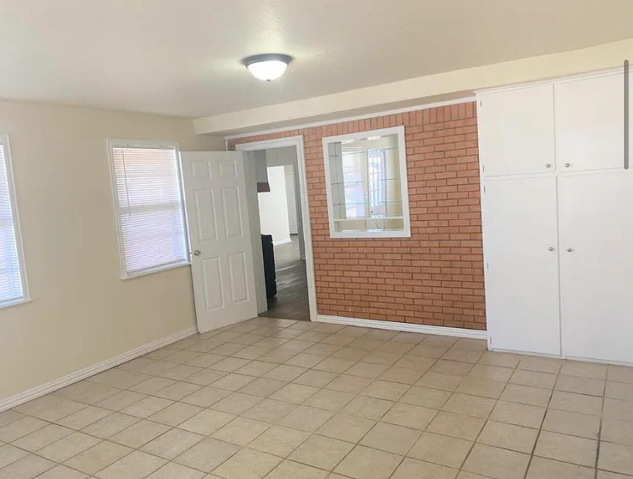 4908 43rd Street Lubbock, TX 79414 - Photo 10 of 18 an empty room with windows