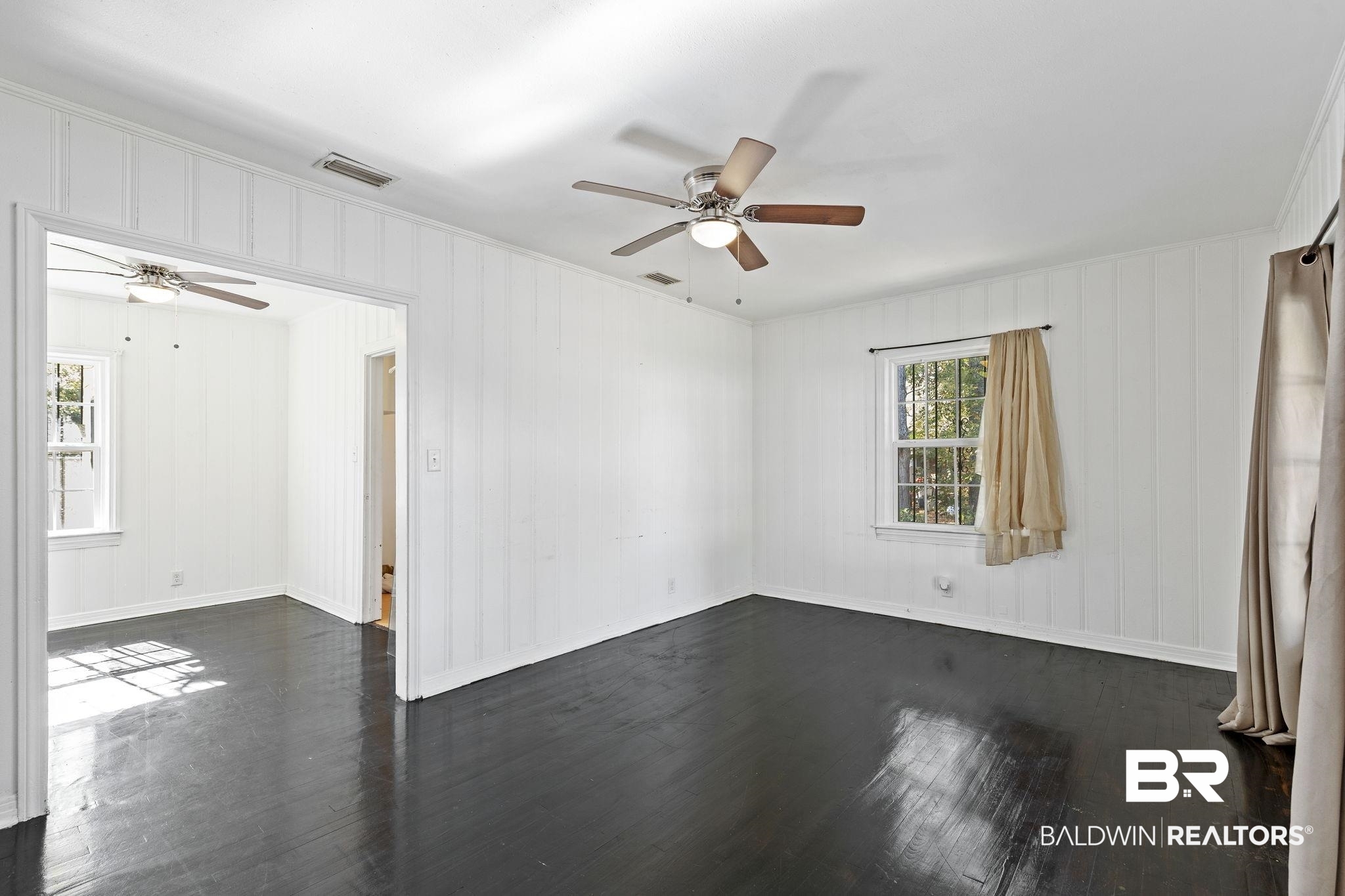 1665 Johnston Street Mobile, AL 36605 - Photo 6 of 17 Unfurnished room featuring dark hardwood / wood-style floors