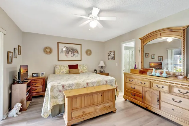 a bed room with a bed and a television