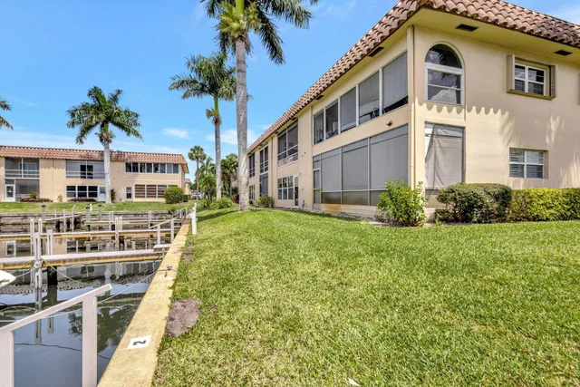 a view of a swimming pool with a table and chairs