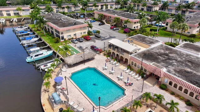 an aerial view of a house with outdoor space and lake view