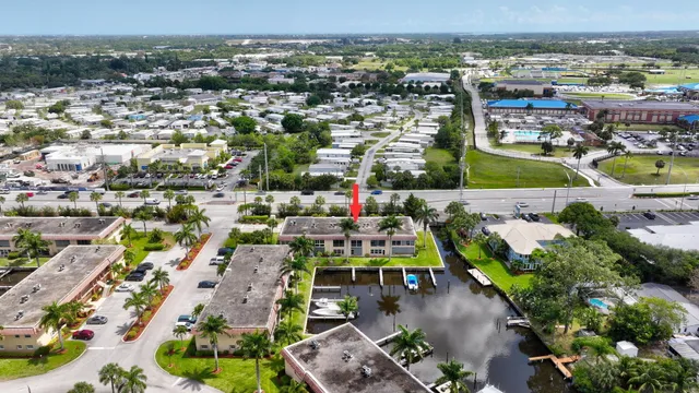 a view of a house with a yard and plant
