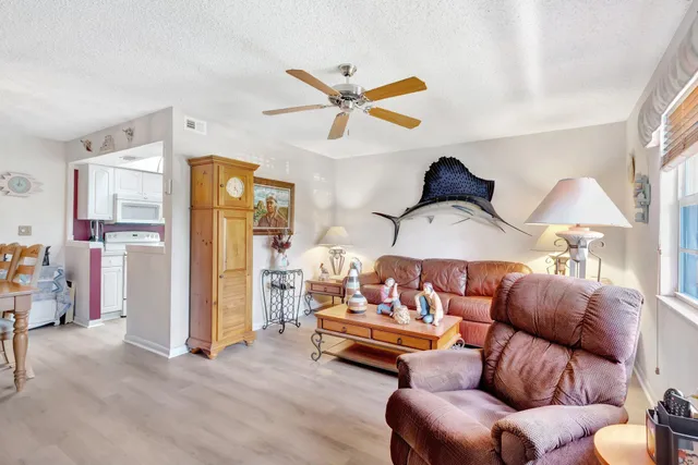 a bedroom with furniture and a large window