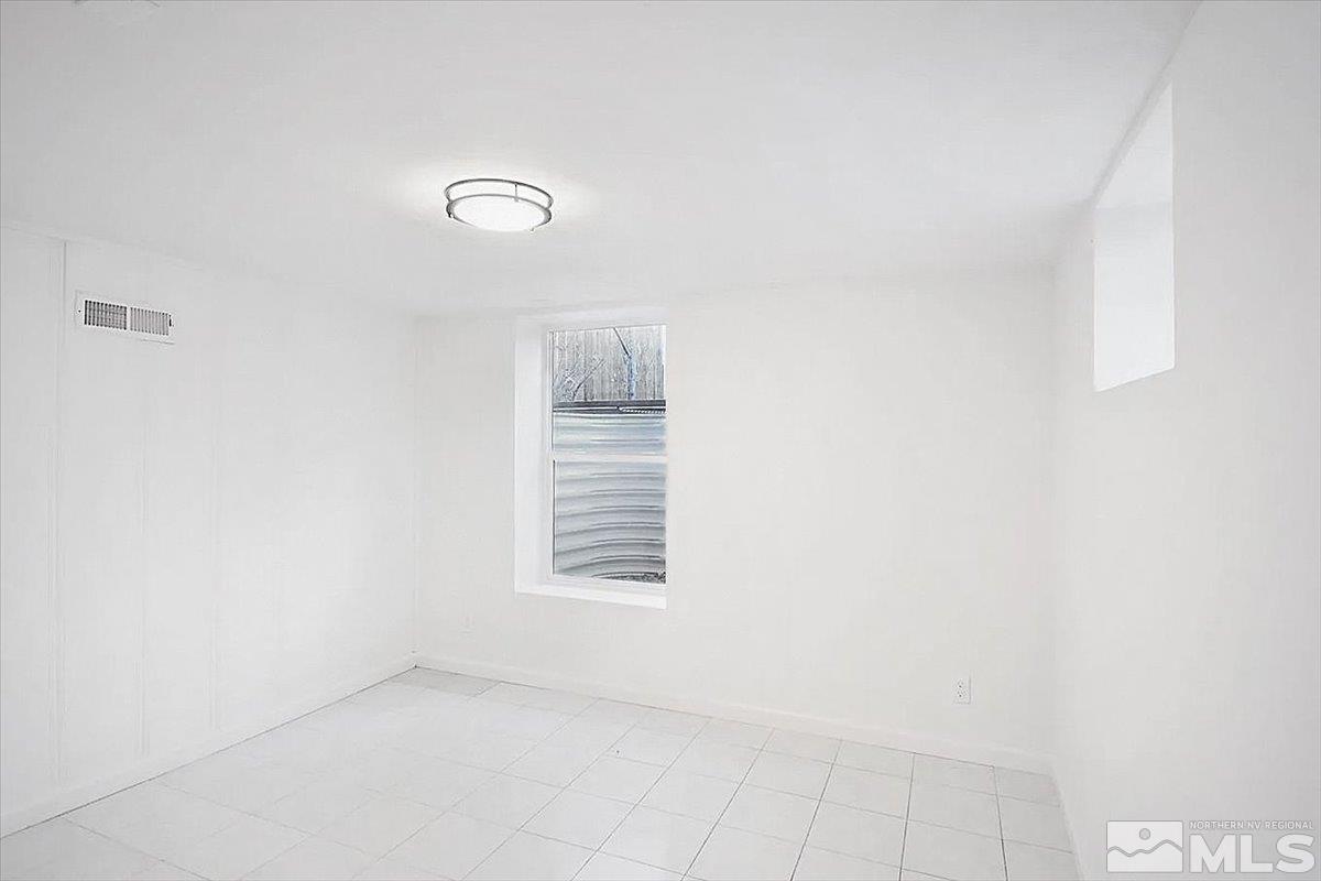 240 Bisby Street Reno, NV 89512 - Photo 18 of 27 an empty room with windows