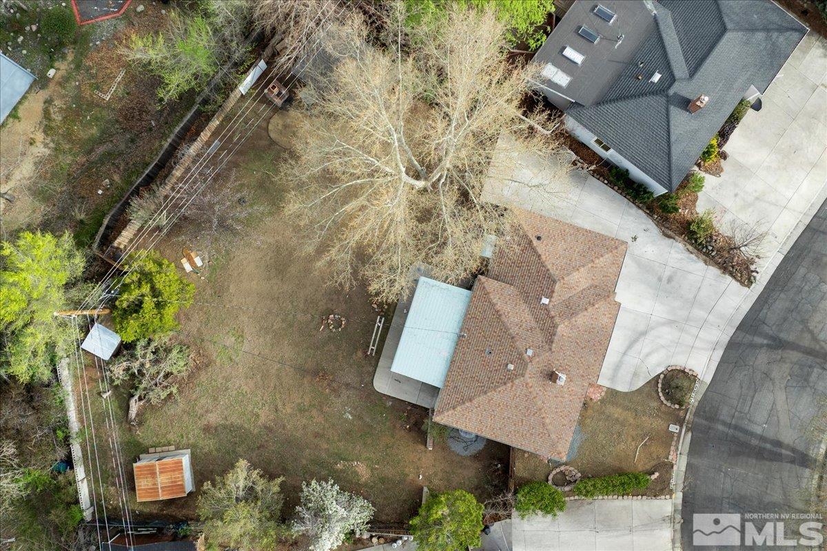 240 Bisby Street Reno, NV 89512 - Photo 23 of 27 an aerial view of a house with a yard and wooden fence