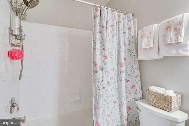 a bathroom with a shower curtain