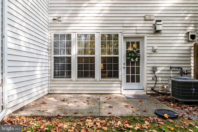 a front view of a house with a chair