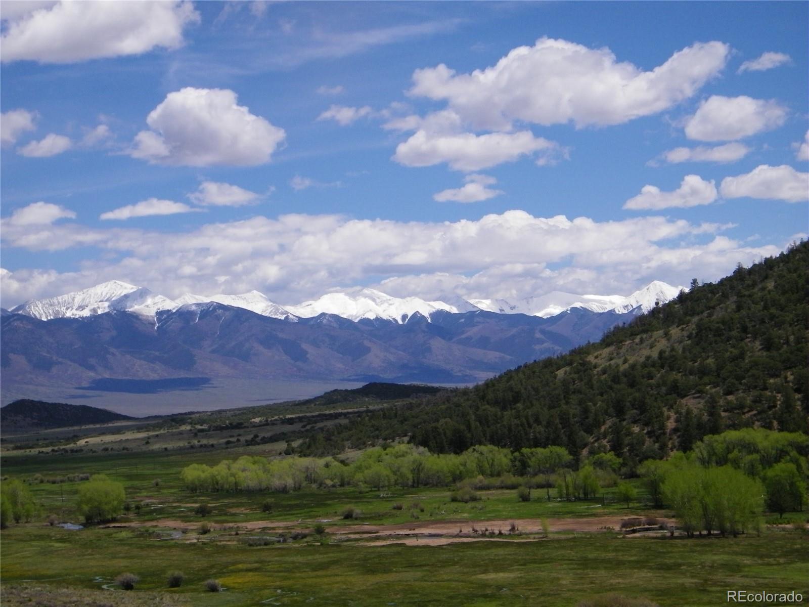 52299 County Rd LL56 Villa Grove, CO 81155 - Photo 19 of 20 a view of a lake with mountains in the background