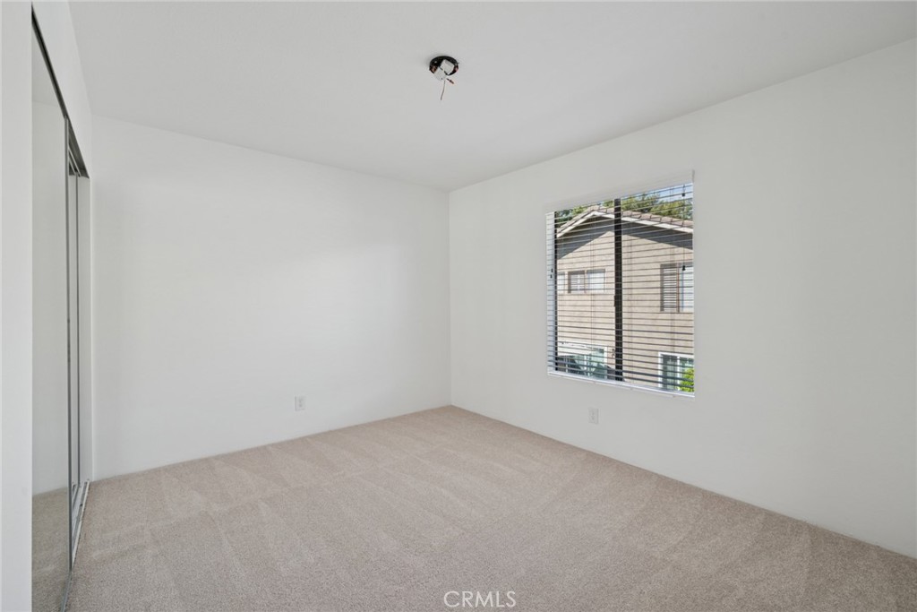 82 Streamwood Irvine, CA 92620 - Photo 16 of 26 an empty room with windows