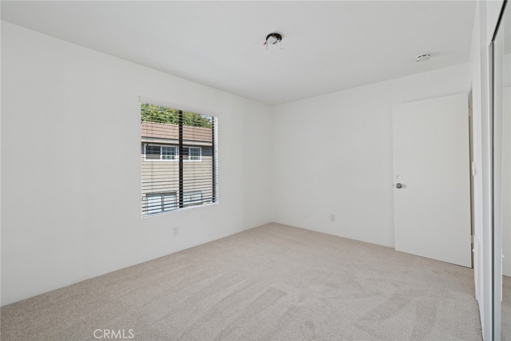 82 Streamwood Irvine, CA 92620 - Photo 17 of 26 an empty room with a window