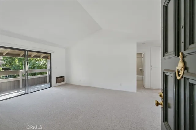 a view of a room with a large window
