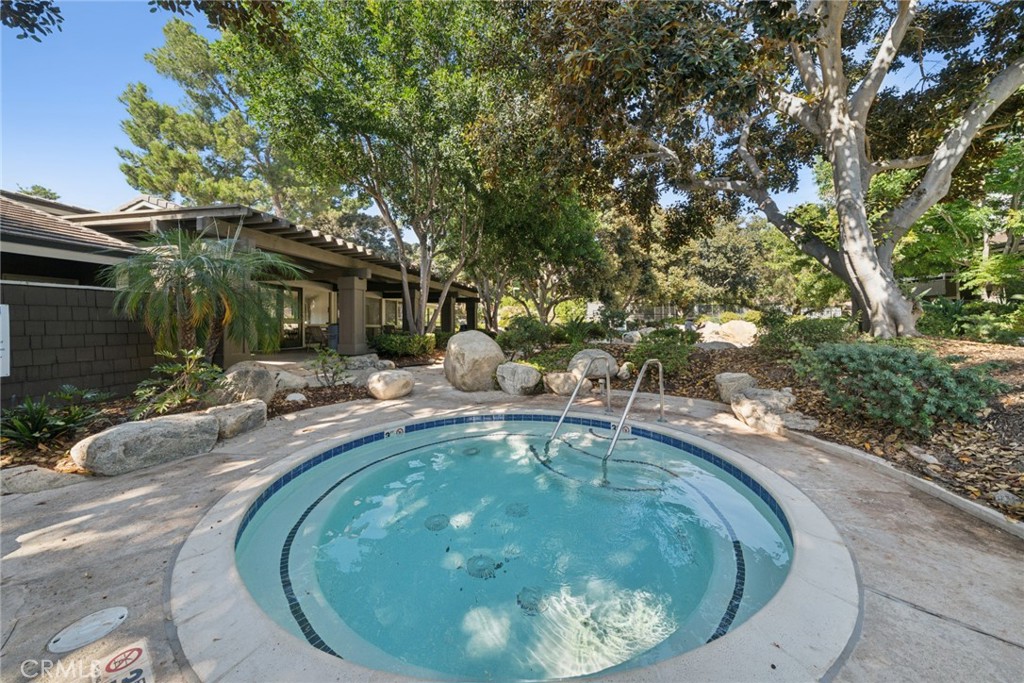 82 Streamwood Irvine, CA 92620 - Photo 25 of 26 a swimming pool with outdoor seating and yard