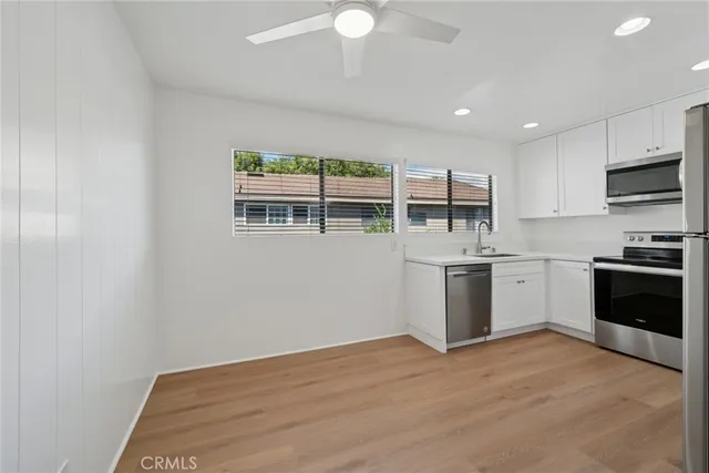 a kitchen with stainless steel appliances granite countertop a stove and a sink