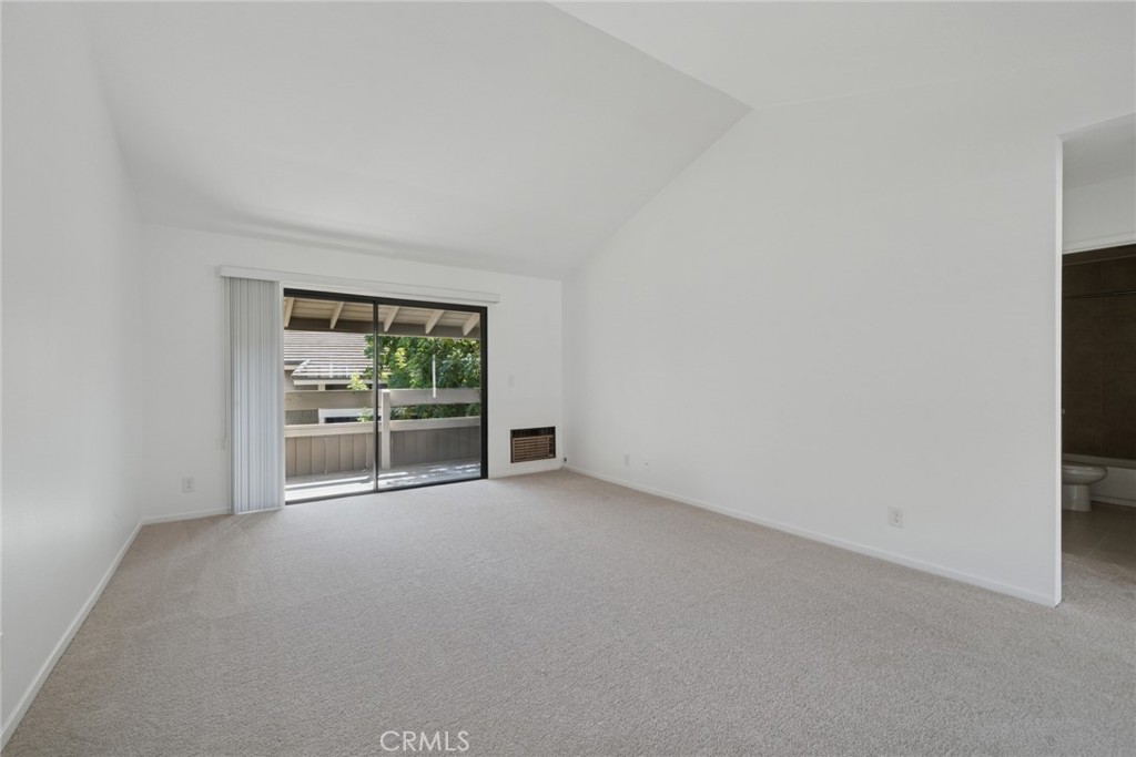 82 Streamwood Irvine, CA 92620 - Photo 6 of 26 a view of an empty room with a fireplace