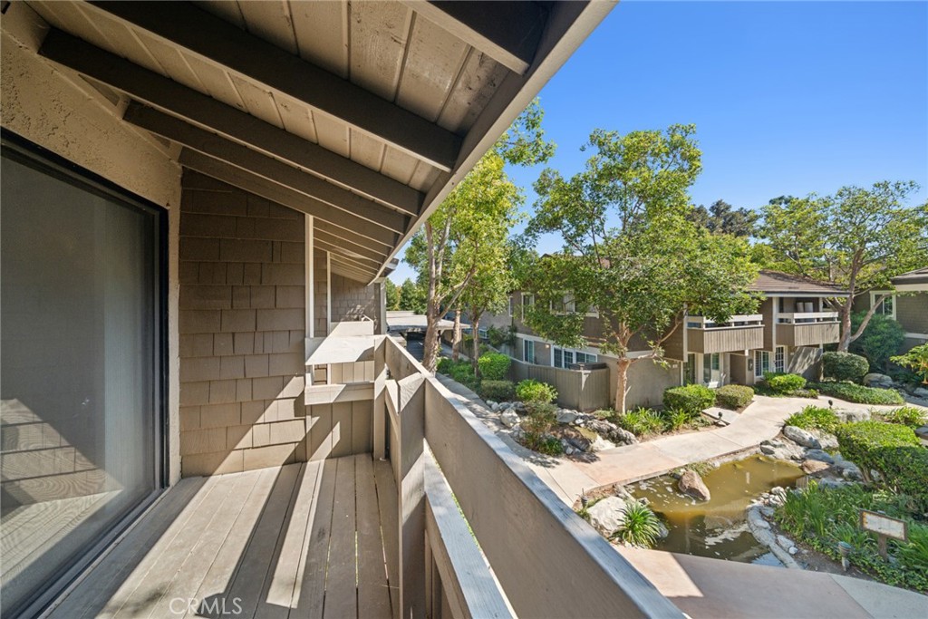82 Streamwood Irvine, CA 92620 - Photo 7 of 26 a view of balcony with wooden floor and outdoor space