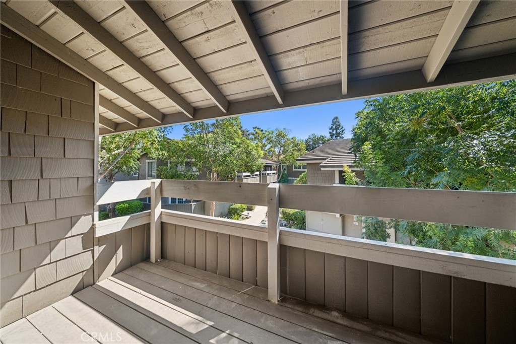 82 Streamwood Irvine, CA 92620 - Photo 8 of 26 a view of a balcony with wooden floor